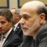 US Treasury Secretary Geithner listens to Federal Reserve Chairman Bernanke testify in Washington