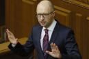 FILE - In this Tuesday, Feb. 16, 2016 file photo Ukrainian Prime Minister Arseniy Yatsenyuk speaks during an annual report in Parliament in Kiev, Ukraine. Ukraine's embattled Prime Minister Arseniy Yatsenyuk says he is resigning, opening the way for the formation of a new government to end a drawn-out political crisis. In his televised address on Sunday, April 10, 2016 Yatsenyuk said his resignation would be formally submitted to parliament on Tuesday. (AP Photo/Sergei Chuzavkov, file)