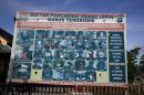 A police billboard showing a list of individuals, including the country's top militant Santoso, wanted in relation with terrorism cases in Poso, Indonesia's Central Sulawesi province