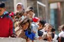 Children are pictured at a camp housing Syrian refugees who fled Hama province, on March 22, 2015 in the Lebanese southern city of Sidon