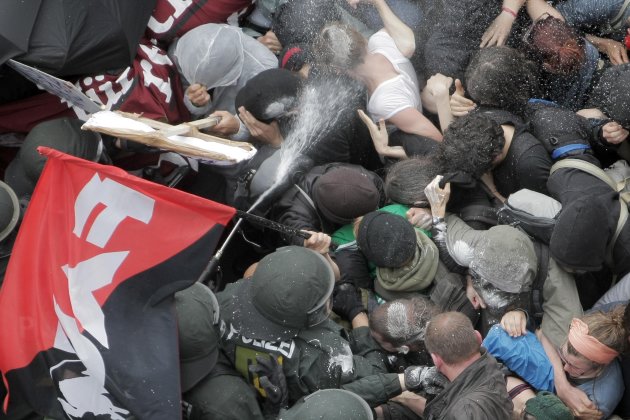 <p> Blockupy protesters clash police in the city of Frankfurt, Germany, Saturday, June 1, 2013. Crowds of anti-capitalist protesters blocked streets leading to the European Central Bank in Germany's financial capital to protest its role in pushing for austerity cutbacks as a way to fight the continent's debt crisis. (AP Photo/dpa, Fredrik von Erichsen)