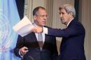 Russian Foreign Minister Sergey Lavrov, left, and U.S. Secretary of State John Kerry, arrive for a press conference after a meeting in Vienna, Austria, Friday, Oct 30, 2015. (AP Photo/Ronald Zak)