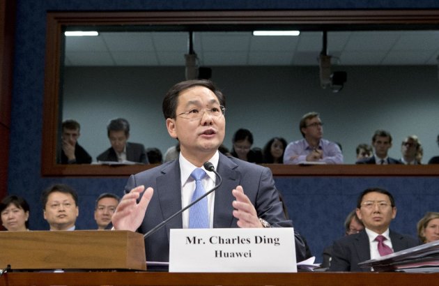 FILE - In this Sept. 13, 2012, Charles Ding, Huawei Technologies Ltd's senior vice president for the U.S., testifies on Capitol Hill in Washington, before the House Intelligence Committee as lawmakers probe whether Chinese tech giants' expansion in the U.S. market pose a threat to national security. In a report to be released Monday, Oct. 8, 2012, the House Intelligence Committee is warning that China's two leading technology firms pose a major security threat to the United States. The panel says regulators should block mergers and acquisitions in the U.S. by Huawei Technologies Ltd. and ZTE Corp. It also advises that U.S. government systems not include equipment from the two firms, and that private U.S. companies avoid business with them. (AP Photo/J. Scott Applewhite, File)