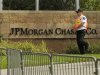 A security guard patrols outside the JP Morgan Chase & Co annual shareholders meeting at the bank's back-office complex in Tampa