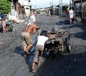 A father and his daughter push a rickshaw loaded with&nbsp;&hellip;