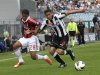 AC Milan's Urby Emanuelson is challenged by Udinese's Allan Marques Loureiro during their Serie A soccer match at Friuli stadium in Udine