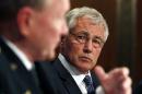 U.S. Secretary of Defense Hagel listens to Chairman of the Joint Chiefs Gen. Dempsey during the defense subcommittee of the Senate Appropriations Committee on Capitol Hill in Washington