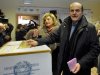 Pier Luigi Bersani, right, leader of the Democratic Party, casts his ballot with his wife Daniela, in Piacenza, Italy, Sunday, Feb. 24, 2013. Italy votes in a watershed parliamentary election Sunday and Monday that could shape the future of one of Europe's biggest economies. (AP Photo/Marco Vasini)