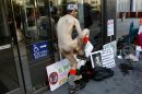 Nudist Chuck Newell removes his clothing at the U.S. Courthouse in San Francisco