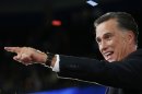 Republican presidential nominee Mitt Romney points to the crowd after his speech during the final session of the Republican National Convention in Tampa