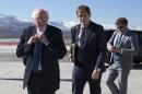 Democratic presidential candidate, Sen. Bernie Sanders, I-Vt. adjusts his tie as he walks to address the media before departing the airport for campaign events in Colorado, Saturday, Feb. 13, 2016, in Reno, Nev. (AP Photo/Evan Vucci)