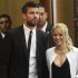 Colombian pop star and United Nations Children's Fund ambassador, Shakira, walks with her boyfriend Gerard Pique, after her joint news conference with Israel's president Peres at 3rd annual Israeli Presidential Conference in Jerusalem