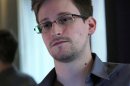 This photo, taken June 9, 2013, in Hong Kong, provided by The Guardian Newspaper in London shows Edward Snowden, who worked as a contract employee at the National Security Agency. Civilian U.S. government scientists worried even a generation ago about the National Security Agency's role in developing global communications standards, according to documents reviewed by The Associated Press. Some scientists wondered why the NSA appeared to choose weaker standards then classified its explanation as top secret. (AP Photo/The Guardian)