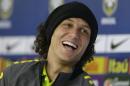 Brazil's David Luiz smiles during a news conference in Teresopolis, Brazil, Friday, June 20, 2014. Brazil plays in group A at the soccer World Cup. (AP Photo/Andre Penner)
