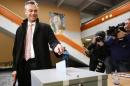 The candidat of the far-right Freedom Party Norbert Hofer drops his ballot at the polling station at the first round of presidental elections on April 24, 2016 in Pinkafeld, Austria