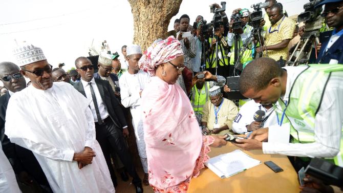 Aisha Buhari (C) registers to vote on March 28, 2015 in Daura, Nigeria