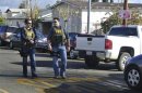 Law enforcement officers wearing FBI vests arrive on the scene after a shooting at Taft Union High School in Taft, California