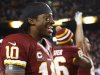 Washington Redskins' Griffin smiles as time runs out in his team's victory over the Dallas Cowboys in their NFL football game in Landover