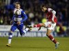 Arsenal's Chamakh shoots to score against Reading during their English League Cup soccer match at Madejski Stadium in Reading