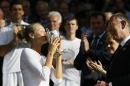 Sofya Zhuk of Russia kisses the trophy after winning the girls' singles final against Anna Blinkova of Russia at the All England Lawn Tennis Championships in Wimbledon, London, Saturday July 11, 2015. (AP Photo/Kirsty Wigglesworth)