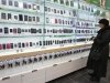 A customer looks at a display of handsets for sale inside a MegaFon shop in St. Petersburg
