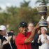 Woods hoists the Gene Sarazen Trophy after winning the 2013 WGC-Cadillac Championship PGA golf tournament in Doral
