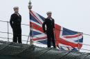 A naval officer stands on the flight deck of British aircraft carrier HMS Ark Royal, in Portsmouth, southern England on November 5, 2010