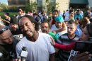FILE - This May 6, 2013 file photo shows neighbor Charles Ramsey speaking to media near the home where missing women Amanda Berry, Gina DeJesus and Michele Knight were rescued in Cleveland. Ramsey, the man who famously put down his Big Mac to help rescue three women held captive for a decade in an Ohio house will never have to pay for another burger in his hometown. Ramsey has been promised free burgers for life at more than a dozen Cleveland-area restaurants. (AP Photo/The Plain Dealer, Scott Shaw, File)