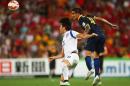Tim Cahill (R) of Australia fights for the ball with Jang Hyunsoo of South Korea during their first round Asian Cup football match at the Suncorp Stadium in Brisbane, Australia, on January 17, 2015