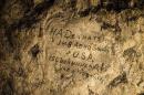 In this image made on Feb. 20, 2015 showing a name engraved on the walls of a former chalk quarry, at the Cite Souterraine, Underground City, in Naours, northern France by HA Deanate, 148th Aero Squadron, USA. 150 Vermilyea Ave, New York City, The names are just some of nearly 2,000 First World War inscriptions that have recently come to light here, a two-hour drive north of Paris, thanks to efforts by Jeffrey Gusky, the site's new owners and local archaeologist Gilles Prilaux. (AP Photo/Jeffrey Gusky) Mandatory Credit