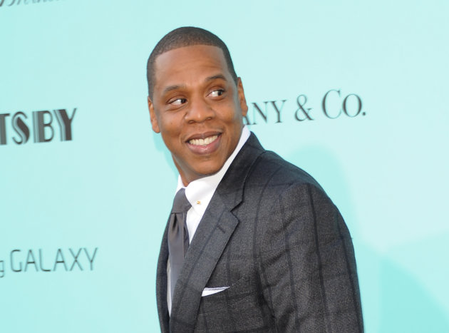 FILE - This May 1, 2013 file photo shows Jay-Z at "The Great Gatsby" world premiere at Avery Fisher Hall in New York. Billboard said Friday it will not include the 1 million album downloads Jay-Z is giving to Galaxy mobile phone users through a deal with Samsung. Jay-Z announced the partnership this week. His new album, "Magna Carta Holy Grail," will be released July 7, but it will go out to 1 million Samsung users on July 4. (Photo by Evan Agostini/Invision/AP, file )
