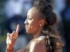 Clemson's Brianna Rollins gestures after winning her heat in the 100-meter hurdles preliminary race during the NCAA Track and Field Championships in Eugene, Ore., Thursday, June 6, 2013.  Rollins set a new American collegiate record. (AP Photo/Don Ryan)