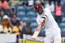 West Indies batsman Marlon Samuels plays a shot during the second Test match between West Indies and England at the Grenada National Stadium in Saint George's on April 21, 2015