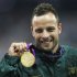South Africa's Pistorius celebrates with gold medal after winning men's 400m T44 classification at Olympic Stadium during the London 2012 Paralympic Games