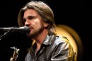 Colombian singer Juanes warms up during a sound check before his concert in Washington, Thursday, July 26, 2012. (AP Photo/Jacquelyn Martin)