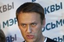 Russian opposition leader Alexei Navalny gestures as he speaks to the media at his headquarters in Moscow, Russia, Sunday, Sept. 8, 2013. Two exit polls in Moscow's mayoral election are predicting a stronger showing than expected for opposition leader Alexei Navalny. Sunday's mayoral election is a potentially pivotal contest that has energized the small opposition in ways that could pose a risk to the Kremlin in the days and years ahead. (AP Photo/Alexander Zemlianichenko)