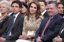 King Abdullah II (R) and Queen Rania (C) of Jordan in Amman on May 25, 2012