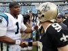 Carolina Panthers quarterback Cam Newton (1) greets New Orleans Saints quarterback Drew Brees (9) after an NFL football game in Charlotte, N.C., Sunday, Sept. 16, 2012. The Panthers won 35-27. (AP Photo/Bob Leverone)