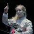 The United States' Mariel Zagunis asks for a ruling in her match against Japan's Seira Nakayama in the women's individual sabre fencing competition at the 2012 Summer Olympics, Wednesday, Aug. 1, 2012, in London.(AP Photo/Dmitry Lovetsky)