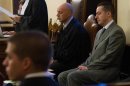 Pope Benedict's former butler Gabriele sits at the start of his trial at the Vatican