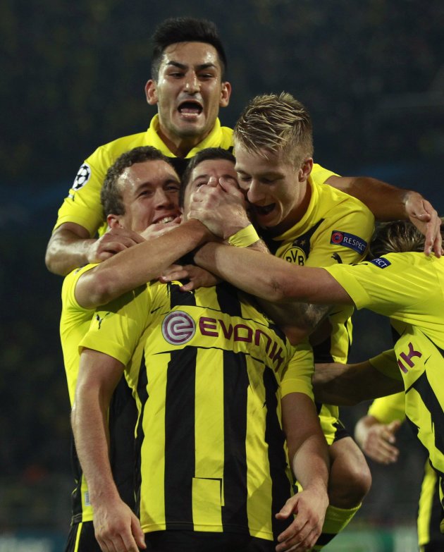 Borussia Dortmund's players celebrate goal against Ajax Amsterdam during Champions League Group D soccer match in Dortmund