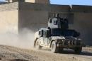 A military vehicle of Iraqi special forces drives during a battle with Islamic State militants in Mosul