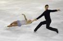 Canadians Meagan Duhamel and Eric Radford perform during the senior pairs short program at the ISU Grand Prix of figure skating Final 2014 in the Barcelona International Convention Centre, on December 11, 2014