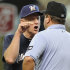 Milwaukee Brewers manager Ron Roenicke, left, argues with first base umpire Sam Holbrook before being ejected in the first inning of a baseball game against the Houston Astros on Saturday, July 7, 2012, in Houston. (AP Photo/Pat Sullivan)