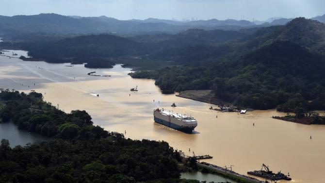 A merchant ship sails along the Panama Canal, on March 23, 2015