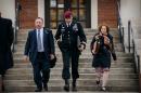 FILE - In this March 4, 2014 file photo, Brig. Gen. Jeffrey Sinclair leaves the courthouse with his lawyers Richard Scheff, left, and Ellen C. Brotman, following a day of motions at Fort Bragg, N.C. Less than a month before Sinclair's trial on sexual assault charges, the lead prosecutor broke down in tears Tuesday as he told a superior he believed the primary accuser in the case had lied under oath. (AP Photo/The Fayetteville Observer, James Robinson) MANDATORY CREDIT