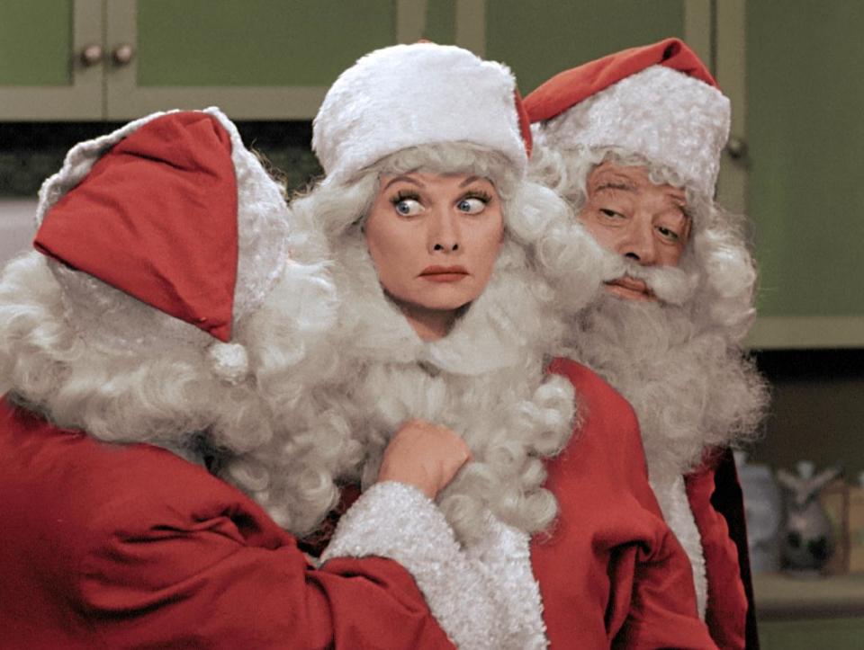 This image released by CBS shows Lucille Ball, center, dressed as Santa Claus in a colorized &quot;I Love Lucy Christmas Special&quot; airing on Friday, Dec. 20, on CBS. (AP Photo/CBS)