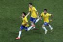 Brazil's Neymar, left, celebrates scoring his side's first goal during the group A World Cup soccer match between Brazil and Croatia, the opening game of the tournament, in the Itaquerao Stadium in Sao Paulo, Brazil, Thursday, June 12, 2014. (AP Photo/Shuji Kajiyama)