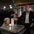 Labour Party PvdA leader Diederik Samsom casts his vote for parliamentary elections as his six-year-old son Benthe, left, and eleven-year-old daughter Fane, center rear, look on at a polling station in Leiden, central Netherlands, Wednesday Sept. 12, 2012. (AP Photo/Peter Dejong)