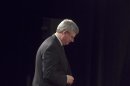 Canadian Prime Minister Stephen Harper walks to the stage for a news conference in Montreal
